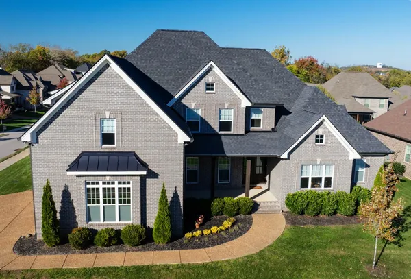 a front view of a house with a yard