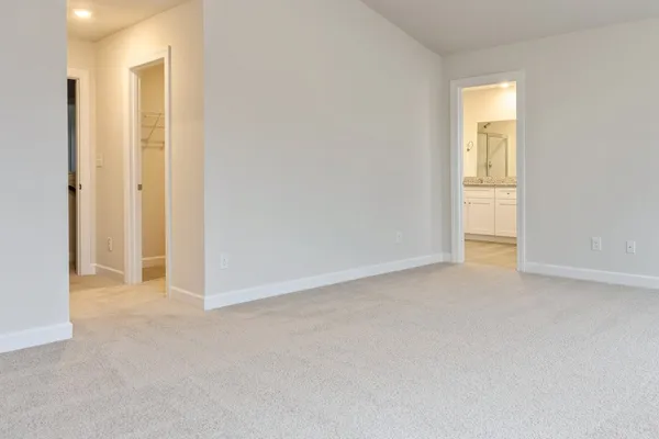 a view of an empty room and a window