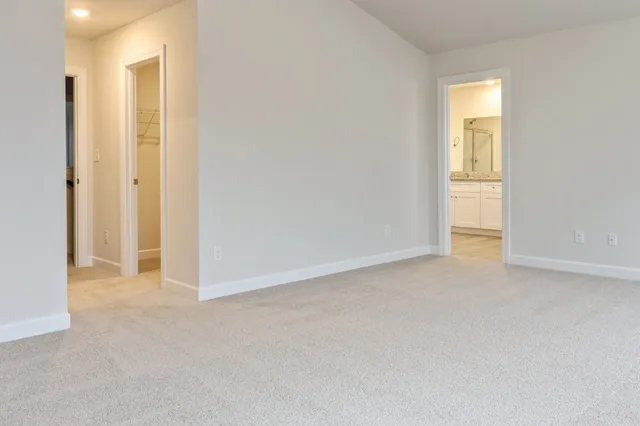 a view of an empty room and a window