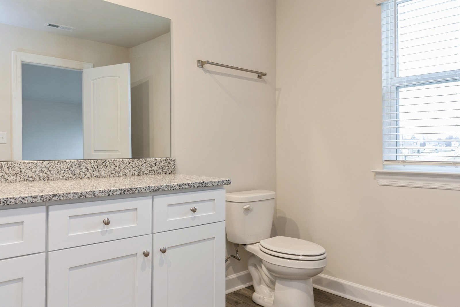 2341 Nabali Way Murfreesboro, TN 37127 - Photo 10 of 23 a bathroom with a granite countertop toilet a sink and a mirror