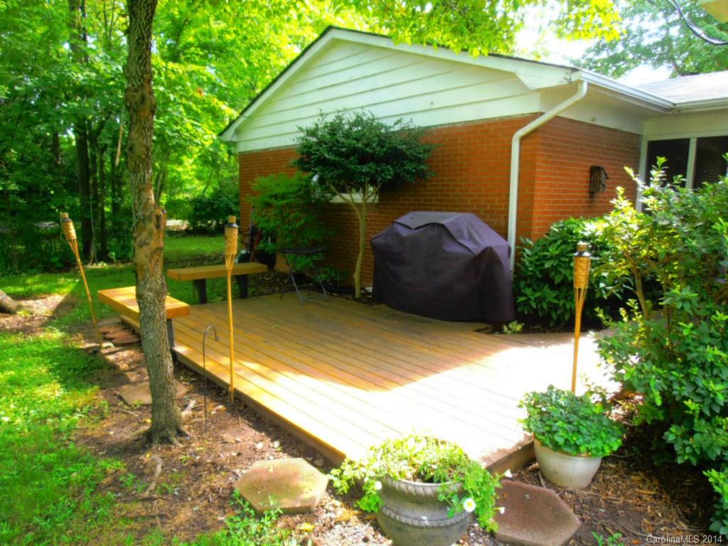 801 Marvin Road Waxhaw, NC 28173 - Photo 12 of 15 a view of backyard with potted plants and a large tree