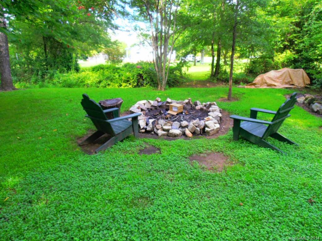 801 Marvin Road Waxhaw, NC 28173 - Photo 15 of 15 a view of a backyard with wooden fence and a bench