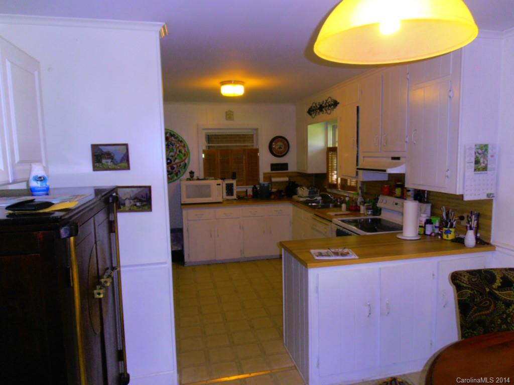 801 Marvin Road Waxhaw, NC 28173 - Photo 3 of 15 a view of a kitchen with a sink and living room view
