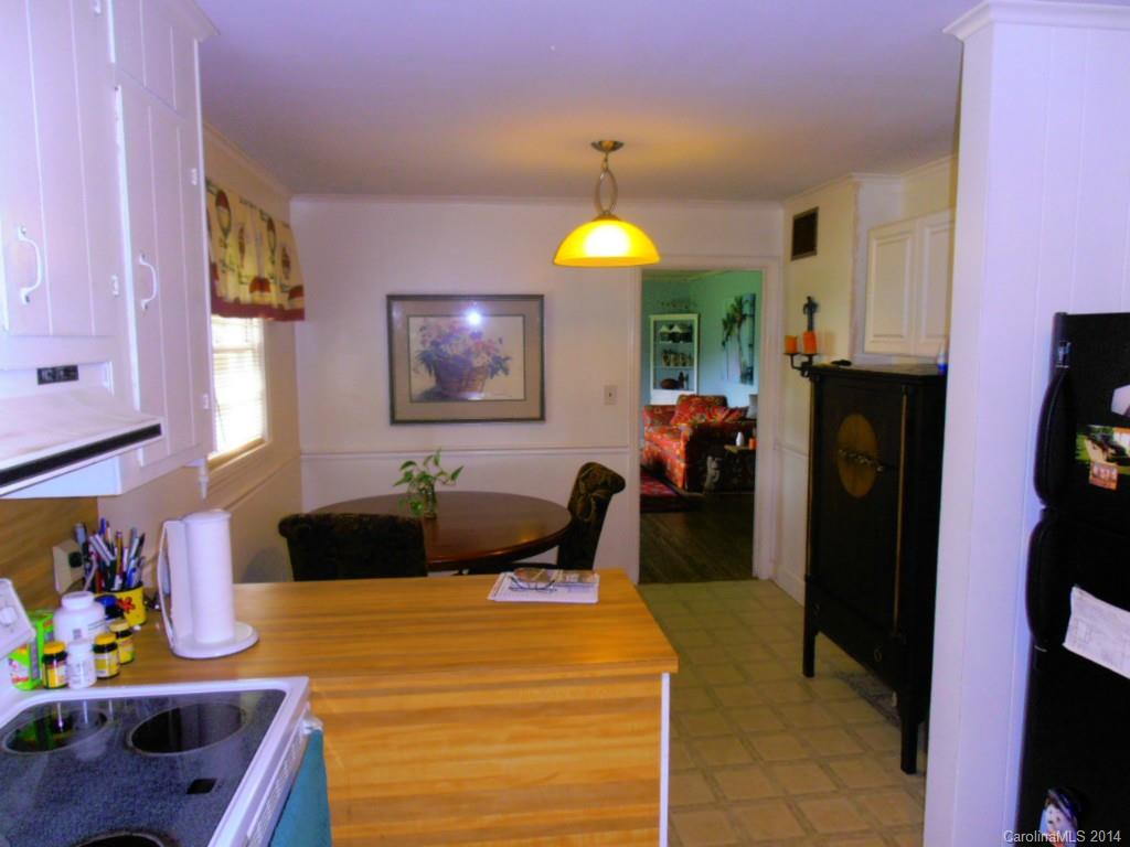 801 Marvin Road Waxhaw, NC 28173 - Photo 4 of 15 a front view of a house with a dining table and chairs