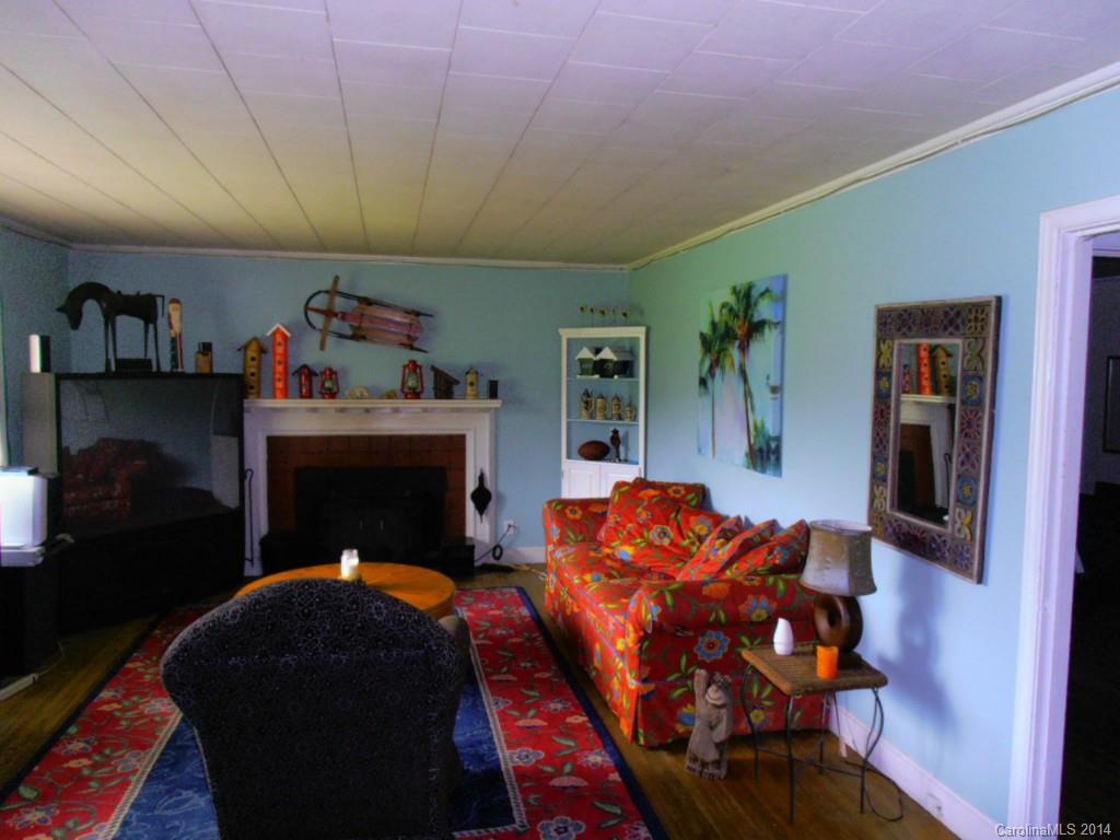 801 Marvin Road Waxhaw, NC 28173 - Photo 5 of 15 a bed room with furniture and a fireplace