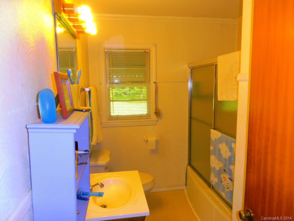 801 Marvin Road Waxhaw, NC 28173 - Photo 8 of 15 a bathroom with a sink and a mirror