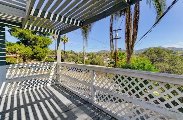 a side view of balcony with wooden floor