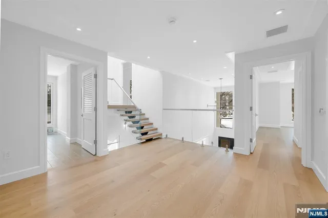 a view of an empty room with a cabinet
