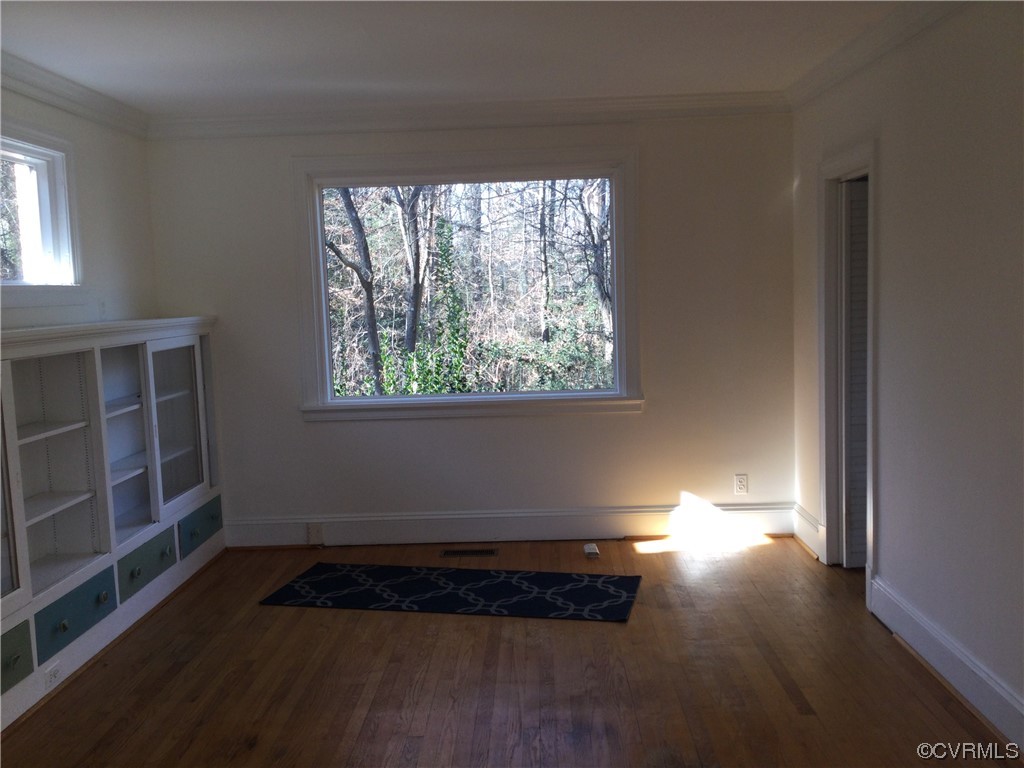 236 Buford Road Richmond, VA 23235 - Photo 15 of 42 an empty room with wooden floor and windows