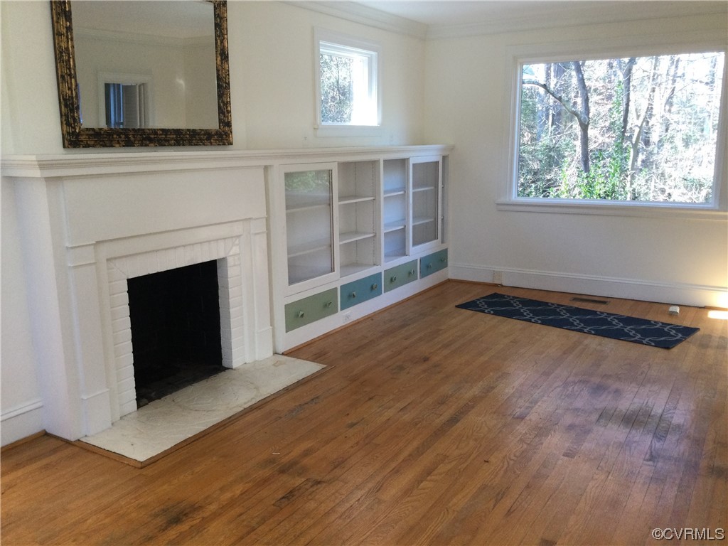 236 Buford Road Richmond, VA 23235 - Photo 16 of 42 a view of an empty room with wooden floor and a window