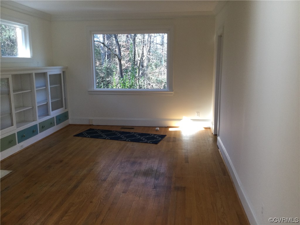 236 Buford Road Richmond, VA 23235 - Photo 17 of 42 an empty room with wooden floor and windows