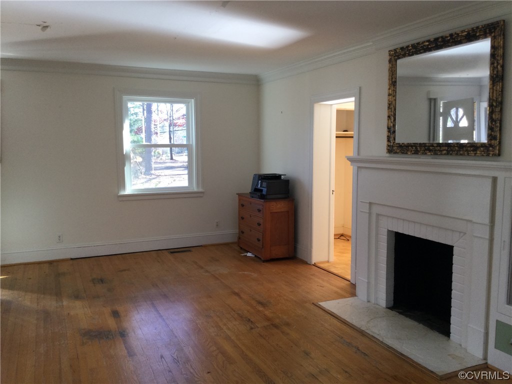 236 Buford Road Richmond, VA 23235 - Photo 18 of 42 a view of an empty room with wooden floor and a window