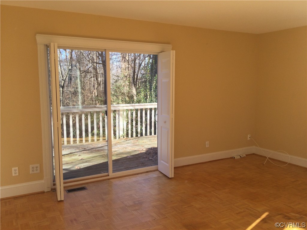 236 Buford Road Richmond, VA 23235 - Photo 23 of 42 an empty room with a fireplace and a window