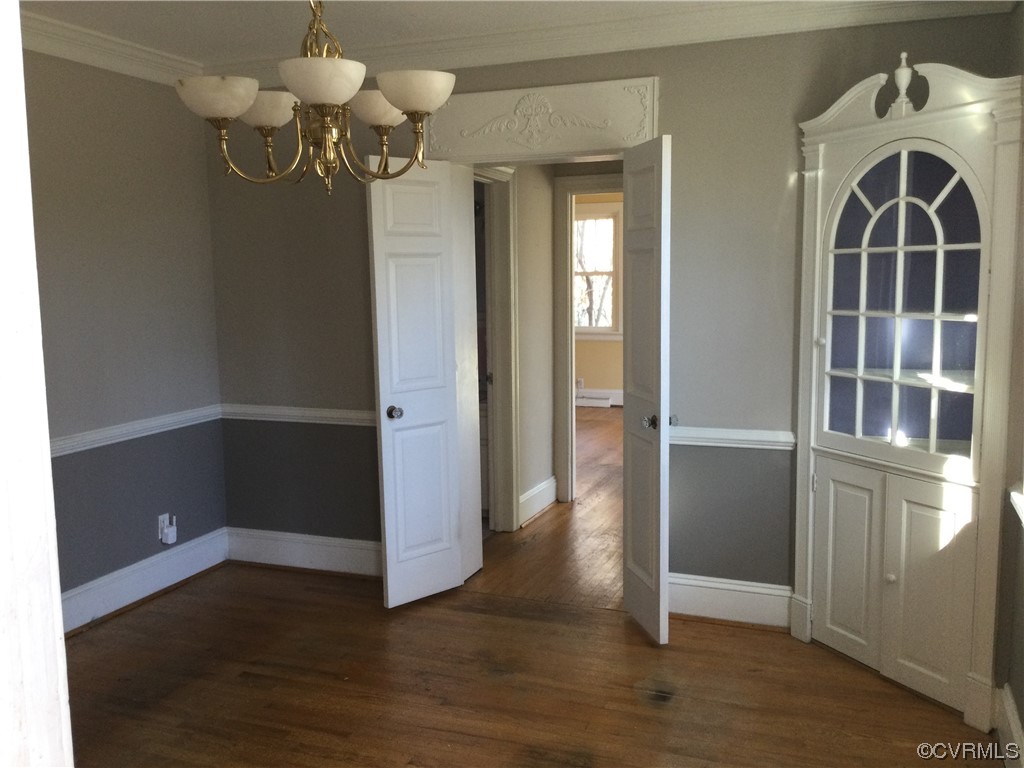 236 Buford Road Richmond, VA 23235 - Photo 24 of 42 an empty room with wooden floor cabinet and windows