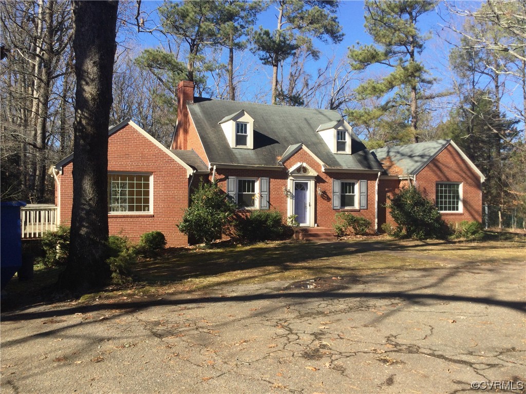 236 Buford Road Richmond, VA 23235 - Photo 3 of 42 a front view of a house with a yard
