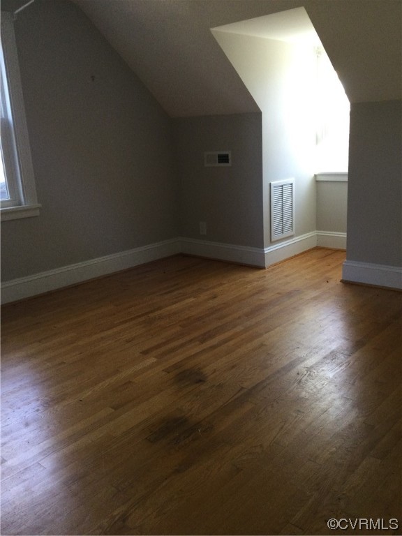 236 Buford Road Richmond, VA 23235 - Photo 34 of 42 an empty room with wooden floor and windows