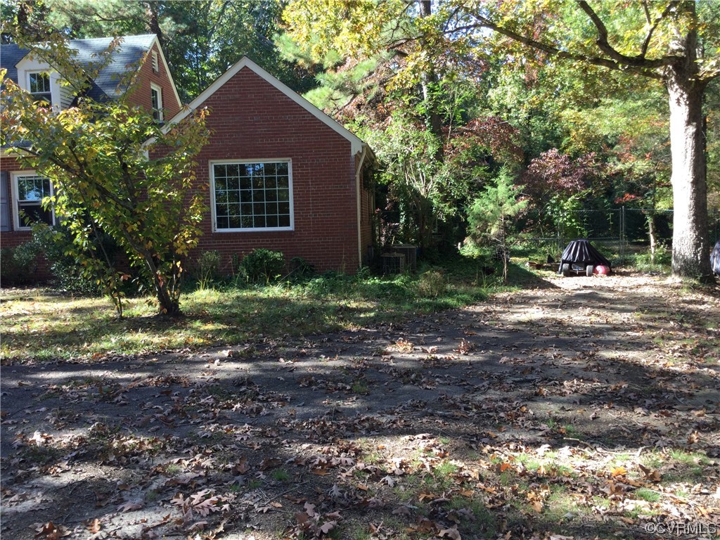 236 Buford Road Richmond, VA 23235 - Photo 5 of 42 a view of a house with a yard