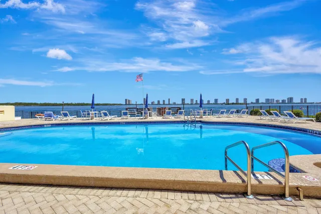 a view of a swimming pool with an outdoor seating