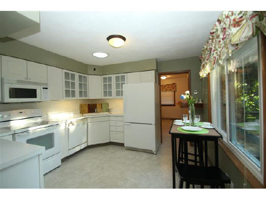 1813 Warren Road Rockford, IL 61108 - Photo 5 of 11 a kitchen with sink and refrigerator