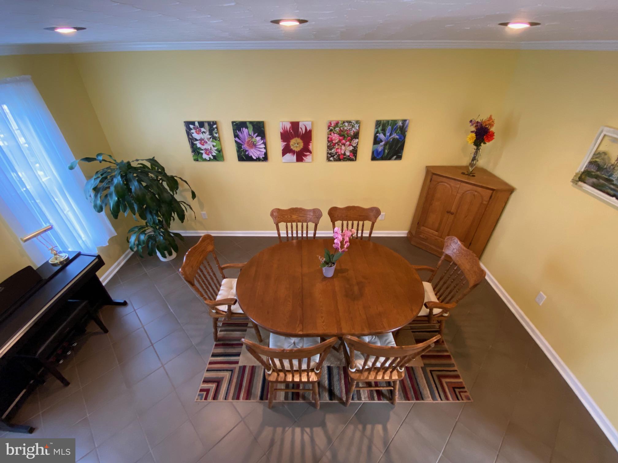 15918 Jerald Road Laurel, MD 20707 - Photo 13 of 40 a view of a dining room with furniture and wooden floor