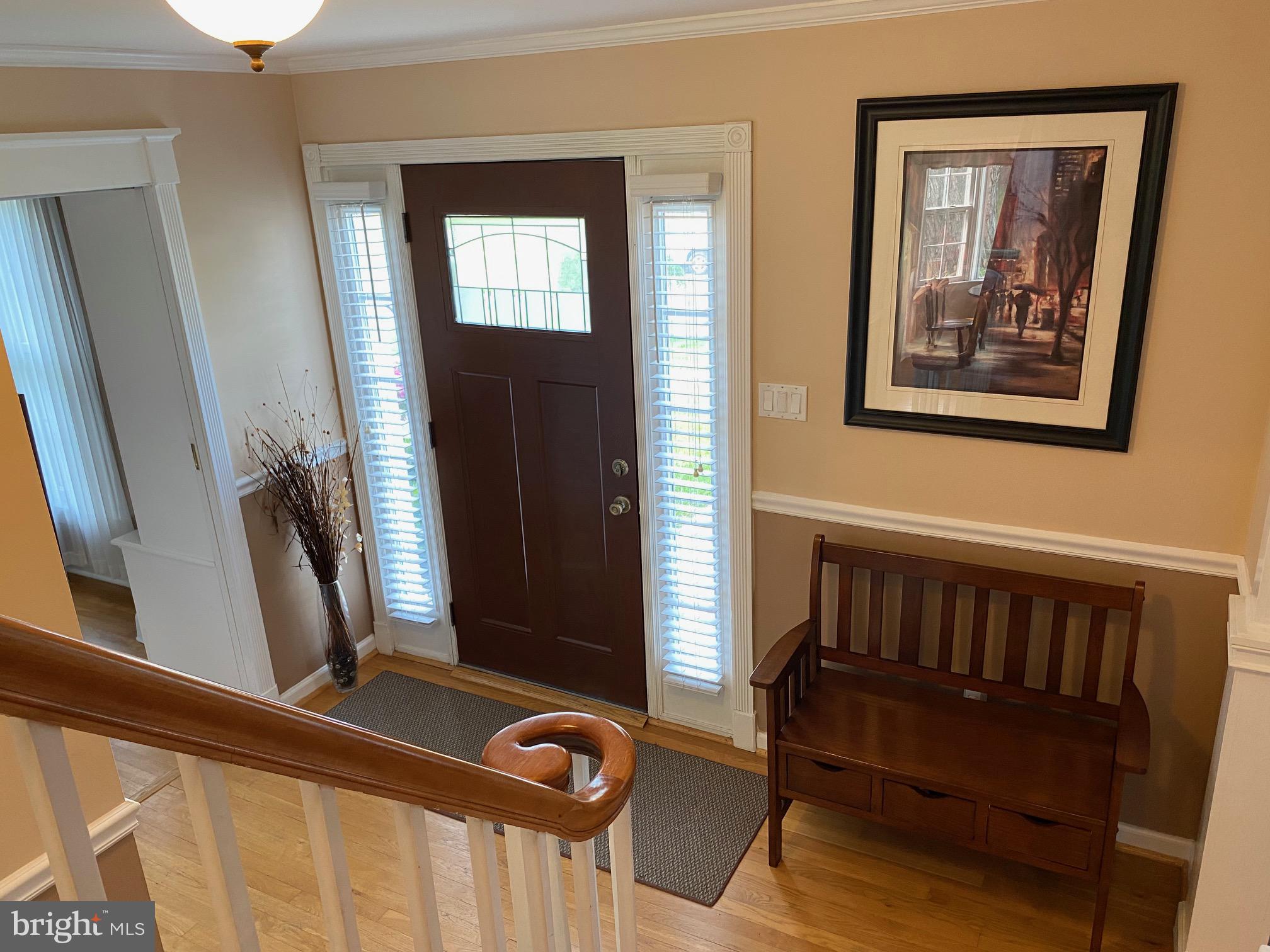 15918 Jerald Road Laurel, MD 20707 - Photo 3 of 40 a view of a hallway with wooden floor and stairs