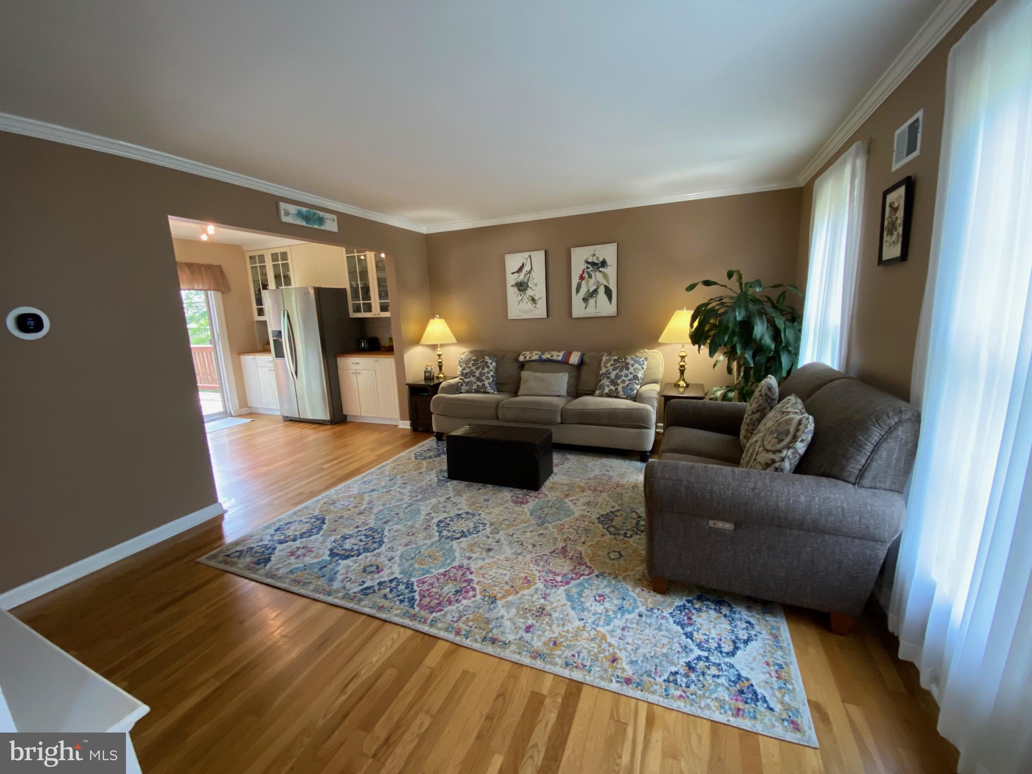 15918 Jerald Road Laurel, MD 20707 - Photo 10 of 40 a living room with furniture rug and wooden floor