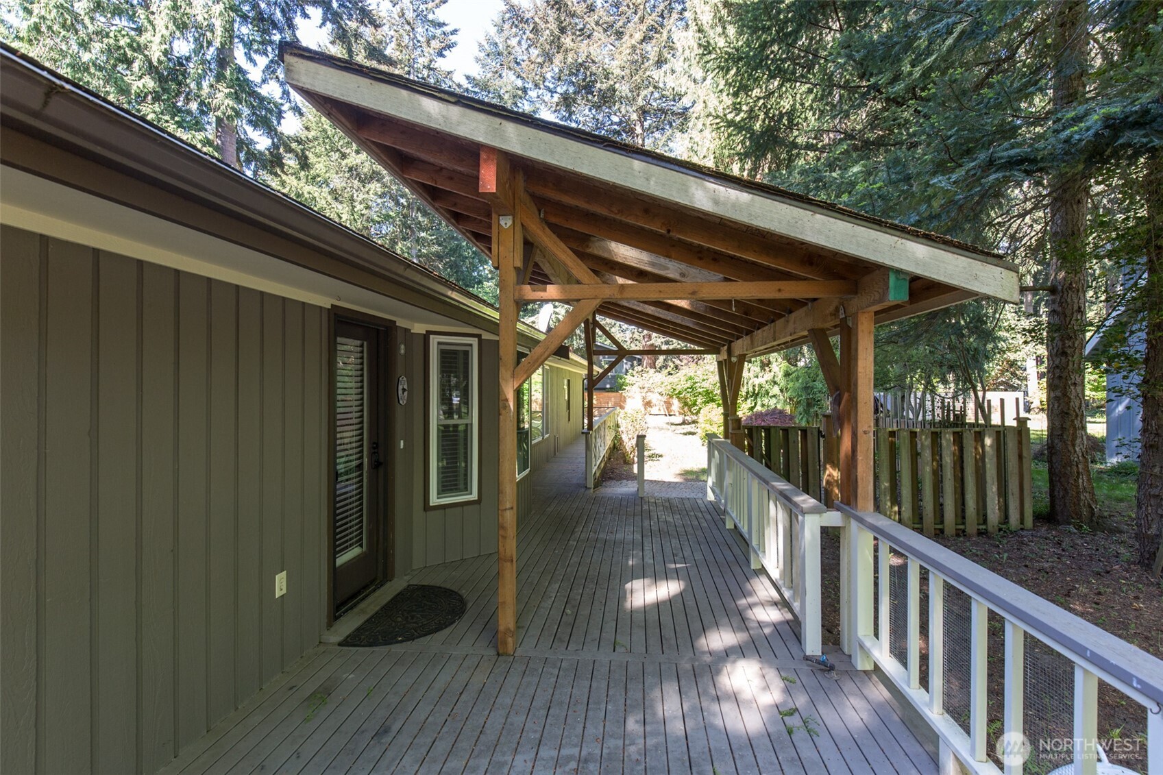 123 Forest Ridge Drive Sequim, WA 98382 - Photo 12 of 32 a view of porch with wooden floor and outdoor seating