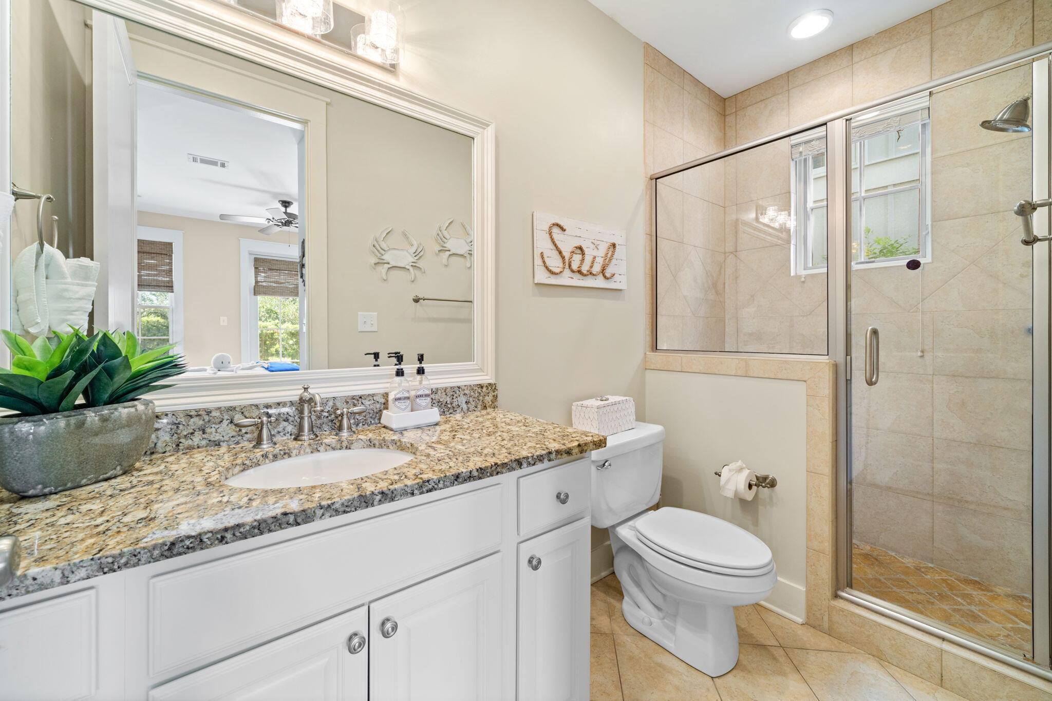 255 Cypress Drive Santa Rosa Beach, FL 32459 - Photo 14 of 81 a bathroom with a granite countertop sink a toilet and shower