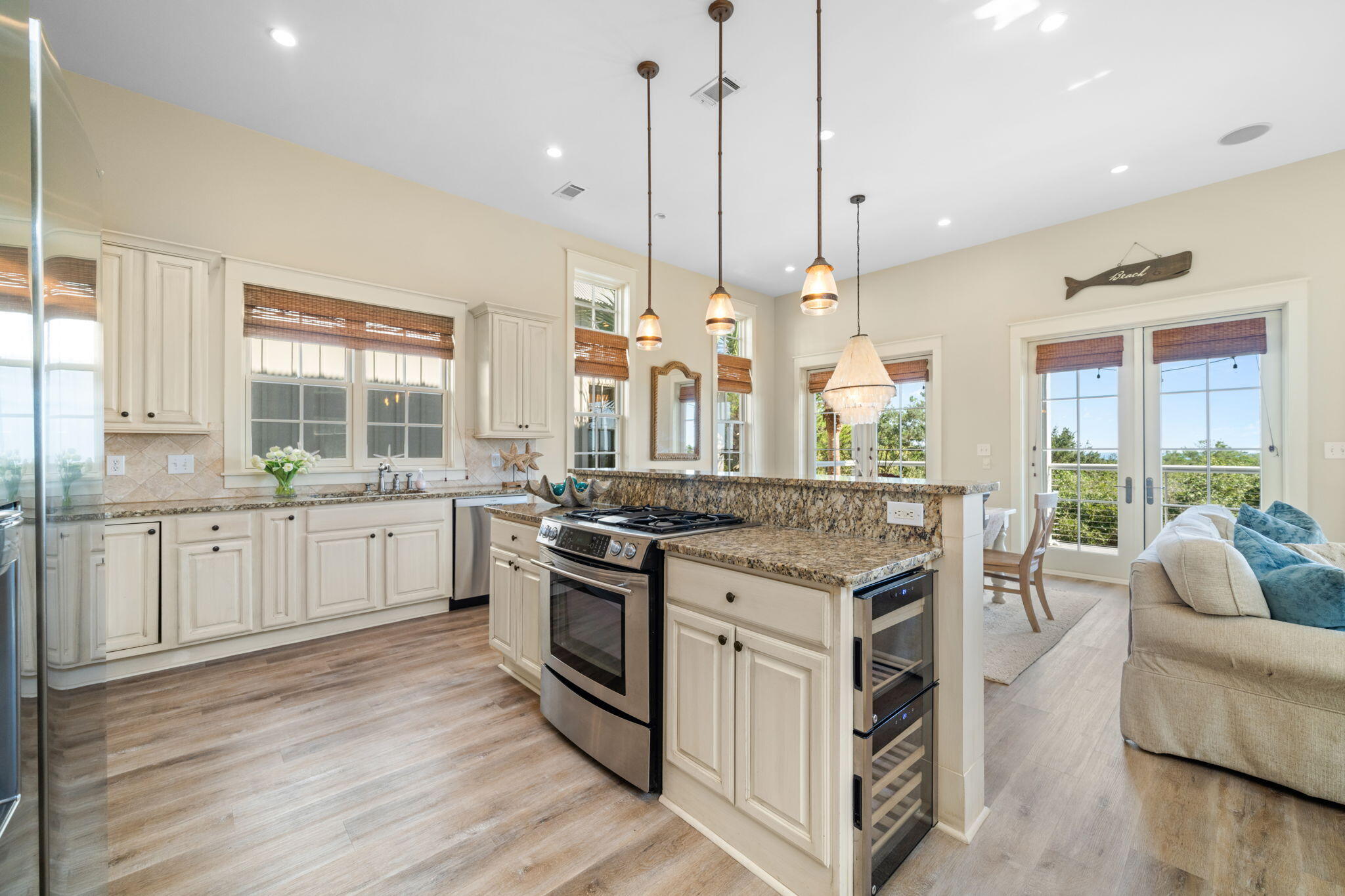 255 Cypress Drive Santa Rosa Beach, FL 32459 - Photo 29 of 81 a open kitchen with stainless steel appliances granite countertop a stove and a large window