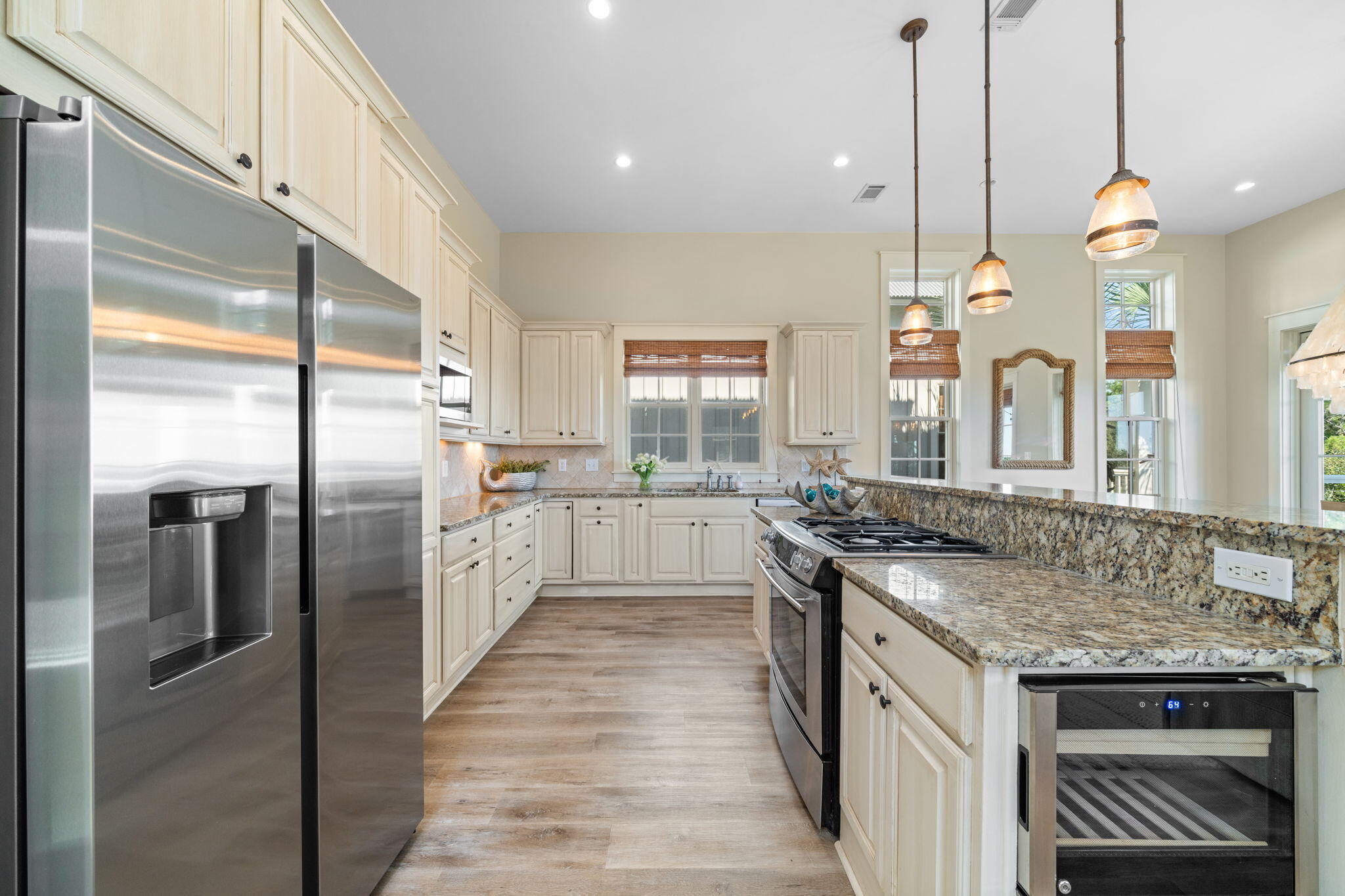 255 Cypress Drive Santa Rosa Beach, FL 32459 - Photo 30 of 81 a kitchen with stainless steel appliances granite countertop a sink a stove and a refrigerator