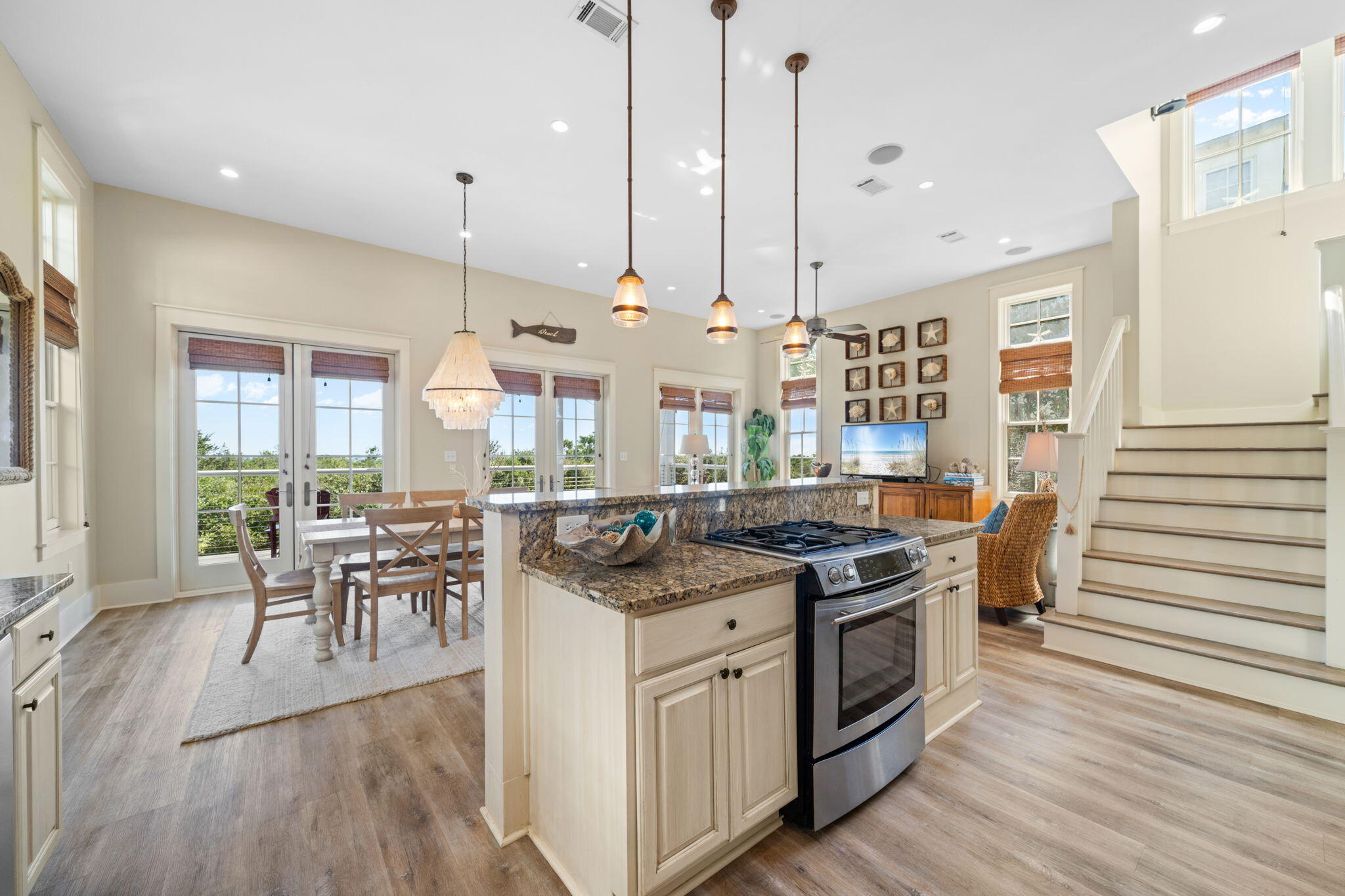 255 Cypress Drive Santa Rosa Beach, FL 32459 - Photo 40 of 81 a kitchen with stainless steel appliances granite countertop a stove a sink and a wooden floors
