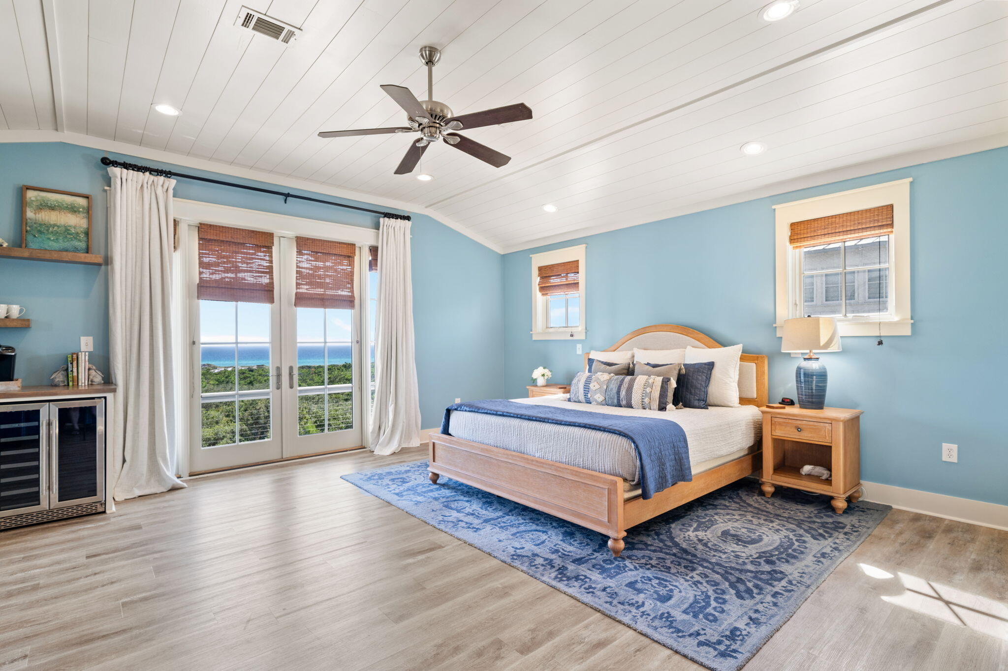 255 Cypress Drive Santa Rosa Beach, FL 32459 - Photo 54 of 81 a spacious bedroom with a bed a dresser and a large window