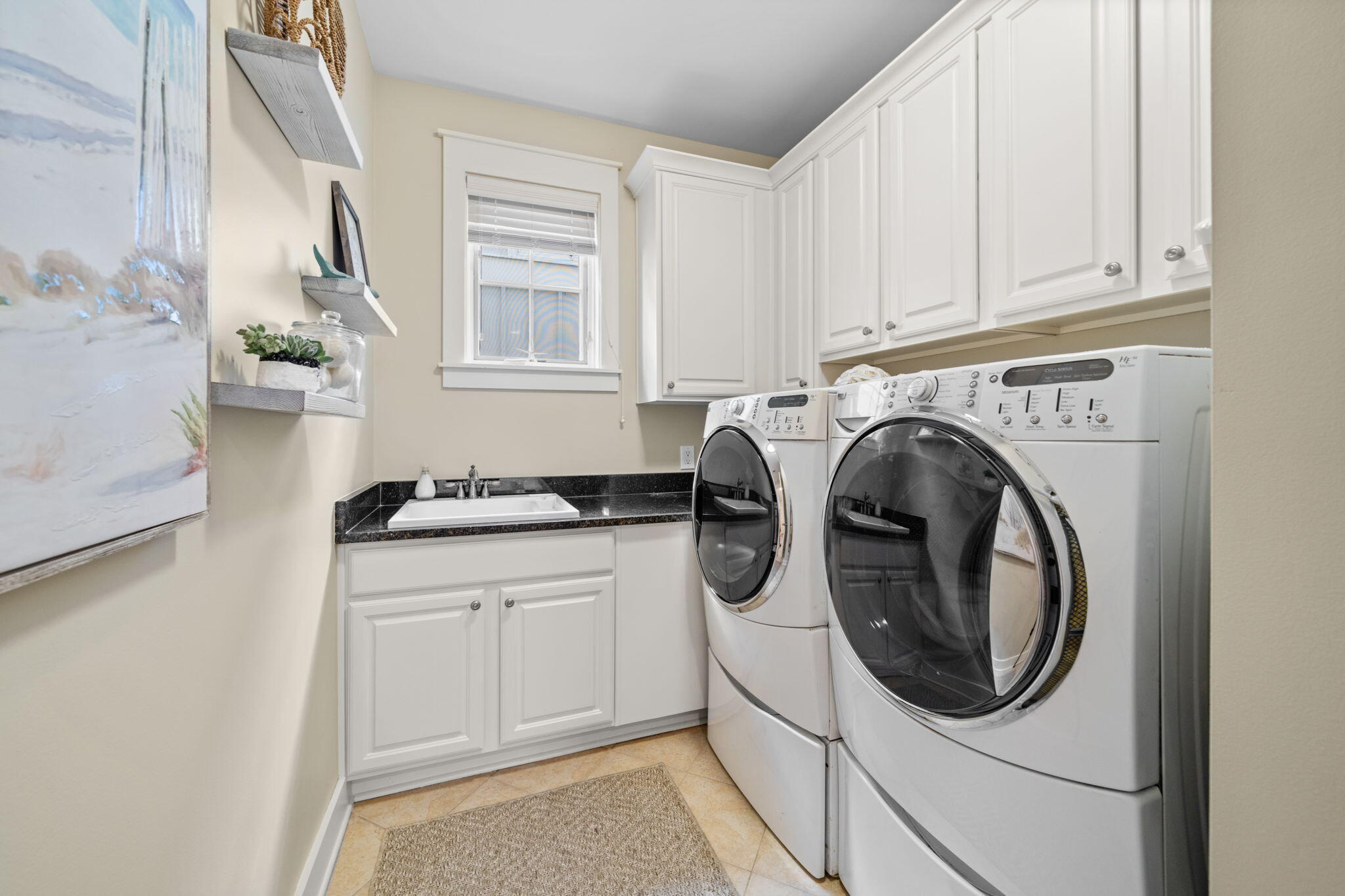 255 Cypress Drive Santa Rosa Beach, FL 32459 - Photo 6 of 81 a utility room with sink dryer and washer