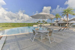 255 Cypress Drive Santa Rosa Beach, FL 32459 - Photo 74 of 81 a view of a chairs and table in the patio and a swimming pool