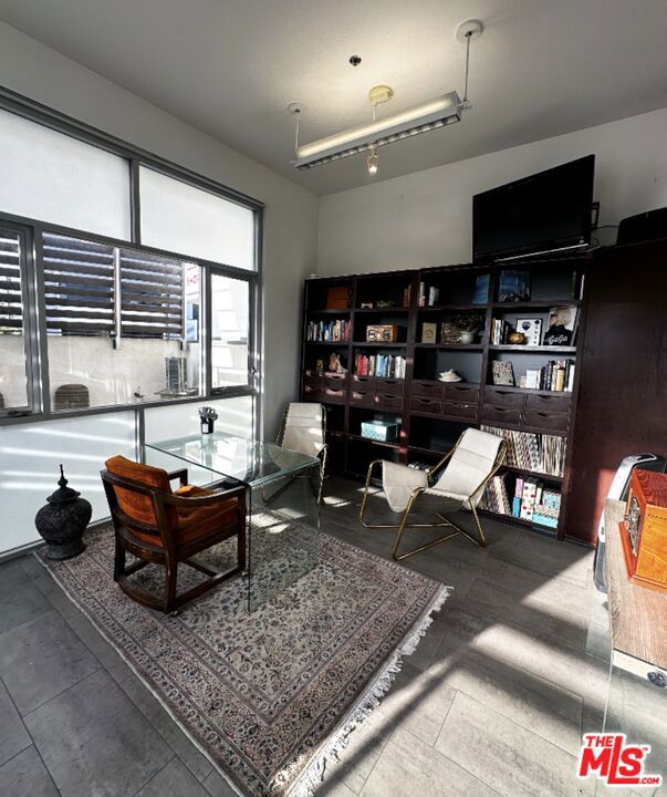 13110 West Washington Boulevard Los Angeles, CA 90066 - Photo 4 of 7 a living room with furniture a rug and a large window
