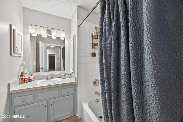 a bathroom with a double vanity sink mirror and double