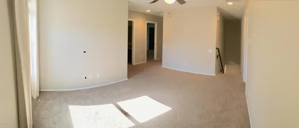 a bathroom with a toilet and a mirror
