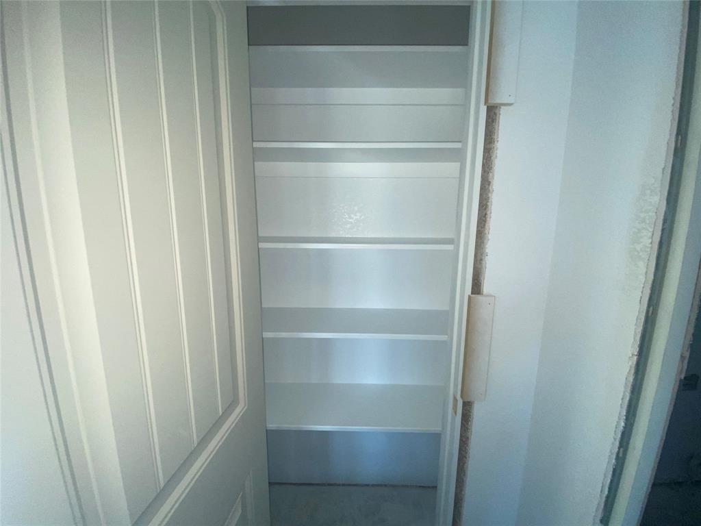 1032 Rays Way Weatherford, TX 76085 - Photo 23 of 25 a view of walk in closet with empty racks