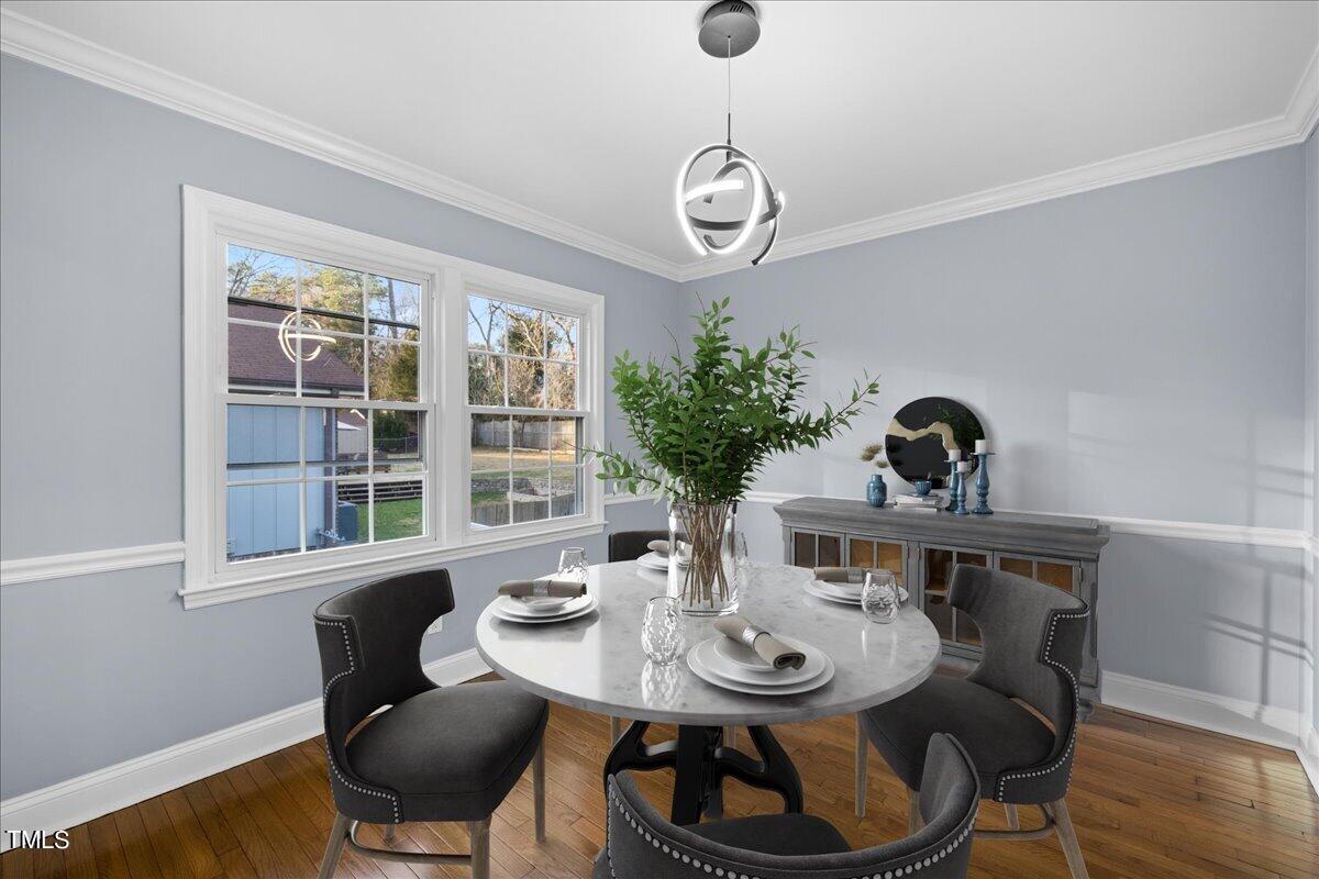 2025 Port Royal Road Raleigh, NC 27609 - Photo 21 of 67 a view of a dining room with furniture window and wooden floor