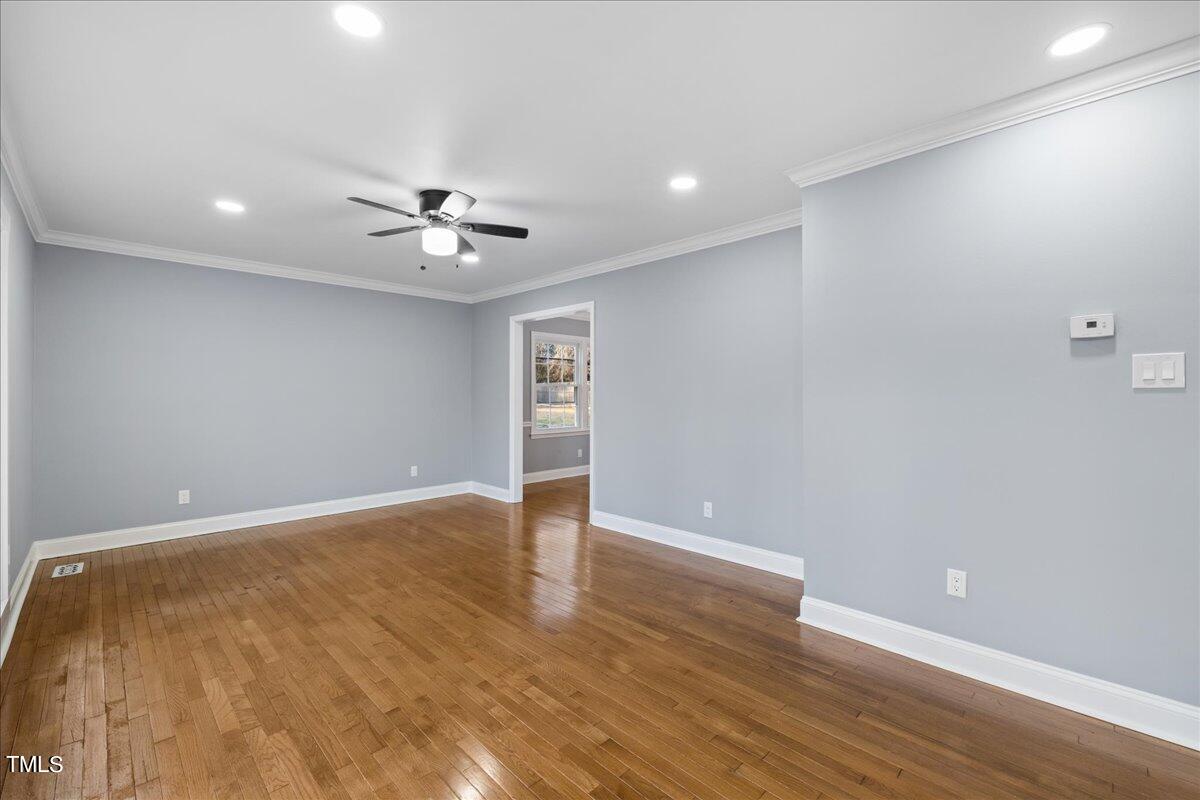 2025 Port Royal Road Raleigh, NC 27609 - Photo 25 of 67 wooden floor in an empty room with a window