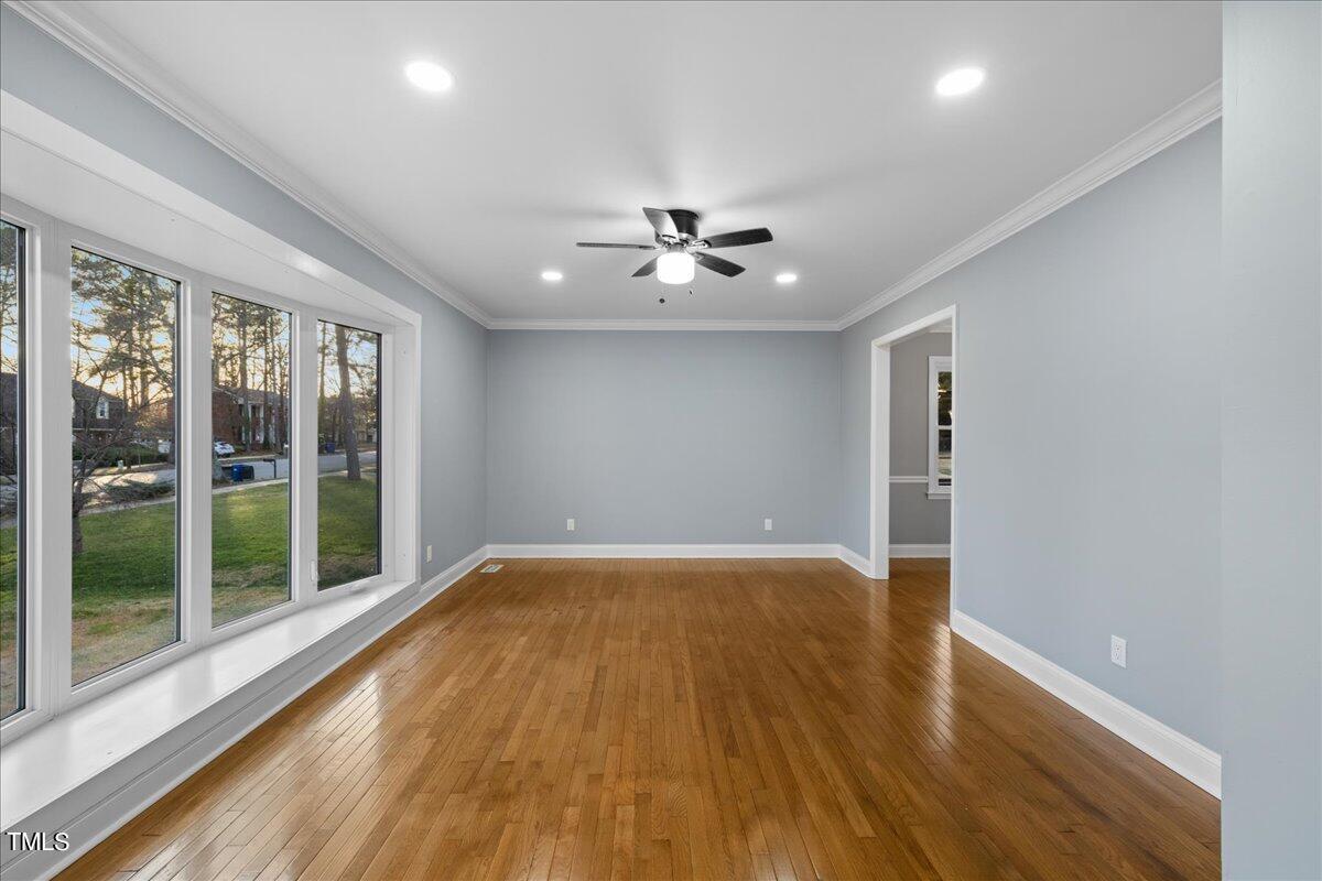 2025 Port Royal Road Raleigh, NC 27609 - Photo 26 of 67 a view of empty room with wooden floor and fan