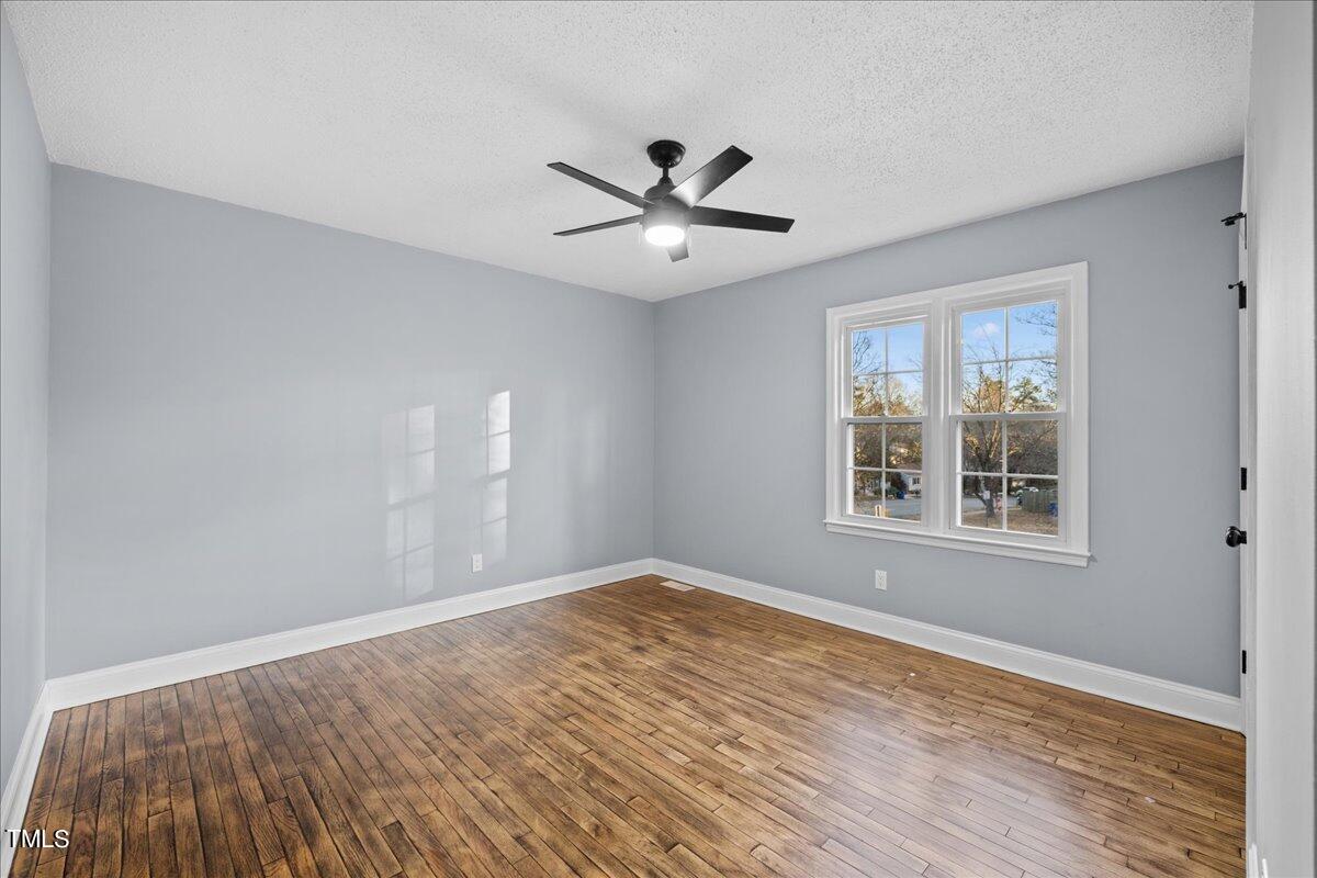 2025 Port Royal Road Raleigh, NC 27609 - Photo 31 of 67 wooden floor in an empty room with a window