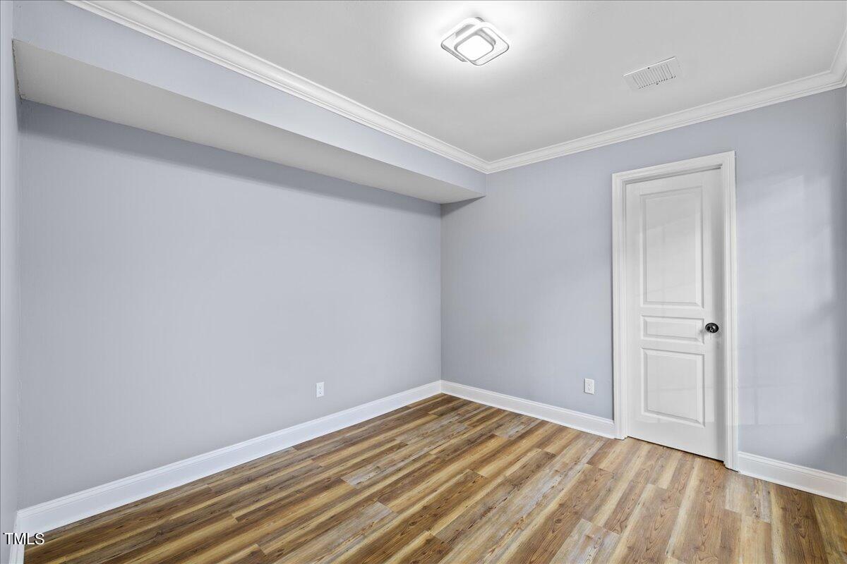 2025 Port Royal Road Raleigh, NC 27609 - Photo 4 of 67 a view of room with wooden floor