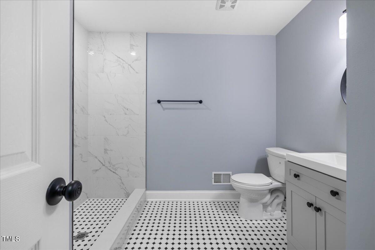 2025 Port Royal Road Raleigh, NC 27609 - Photo 41 of 67 a bathroom with a toilet and a shower
