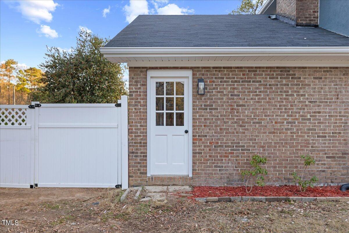 2025 Port Royal Road Raleigh, NC 27609 - Photo 55 of 67 a front view of a house with a yard