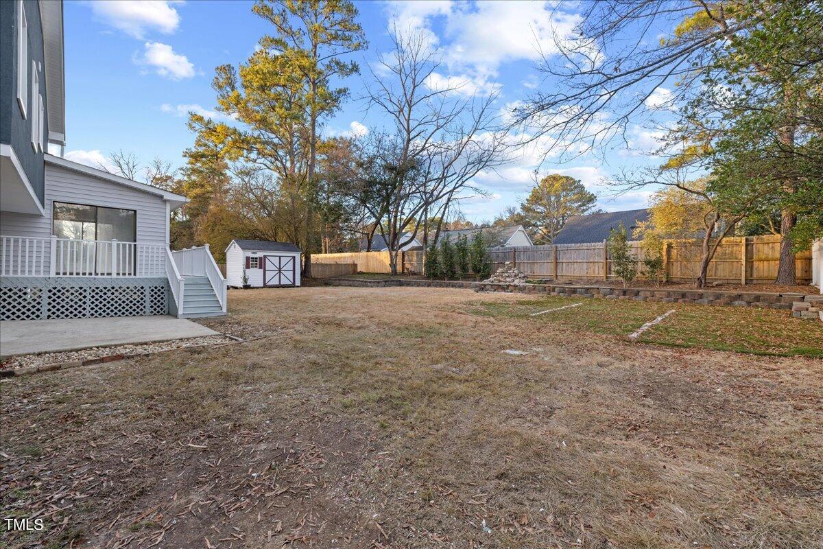 2025 Port Royal Road Raleigh, NC 27609 - Photo 56 of 67 a view of a yard with a large tree