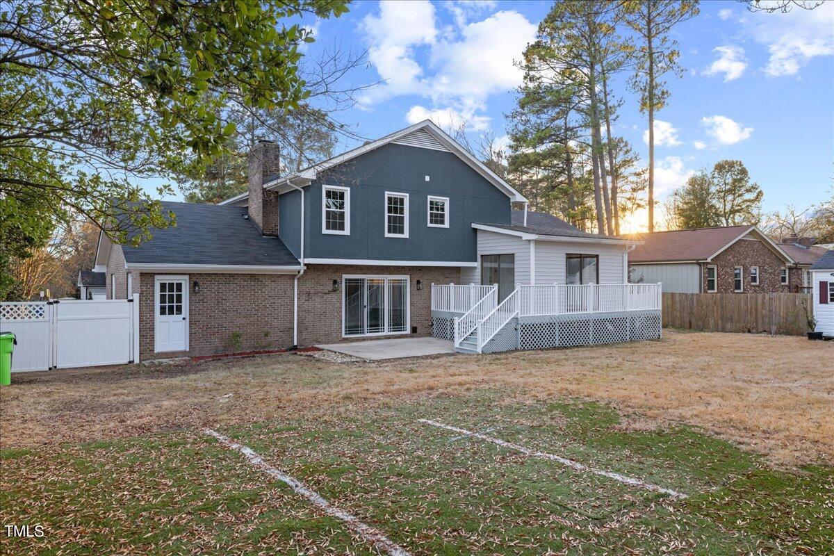 2025 Port Royal Road Raleigh, NC 27609 - Photo 57 of 67 a front view of a house with a yard and garage
