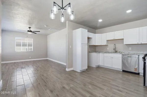 a view of a kitchen with electric appliances