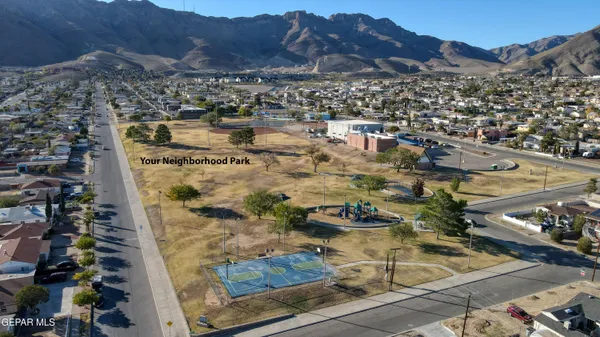 an aerial view of residential houses and outdoor space