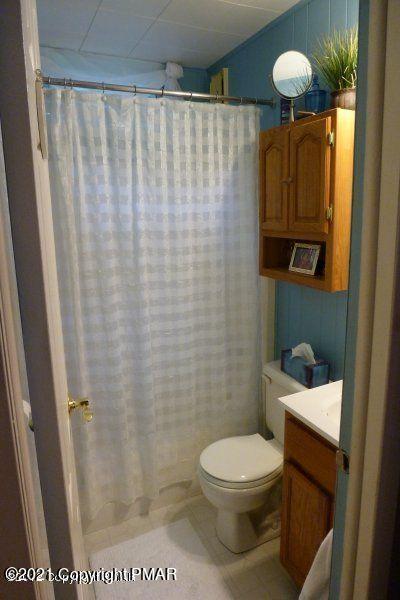 155 Chipmunk Road Bushkill, PA 18324 - Photo 14 of 18 a bathroom with a toilet and a shower